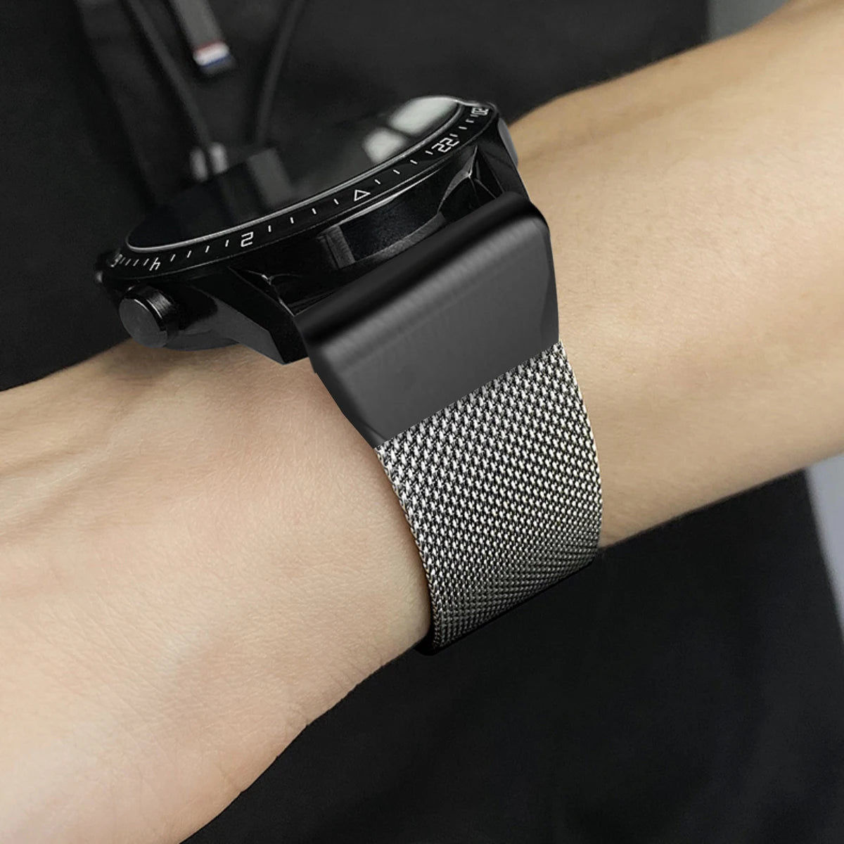Garmin smartwatch with a durable stainless steel replacement strap, showcasing a sleek and adjustable design.