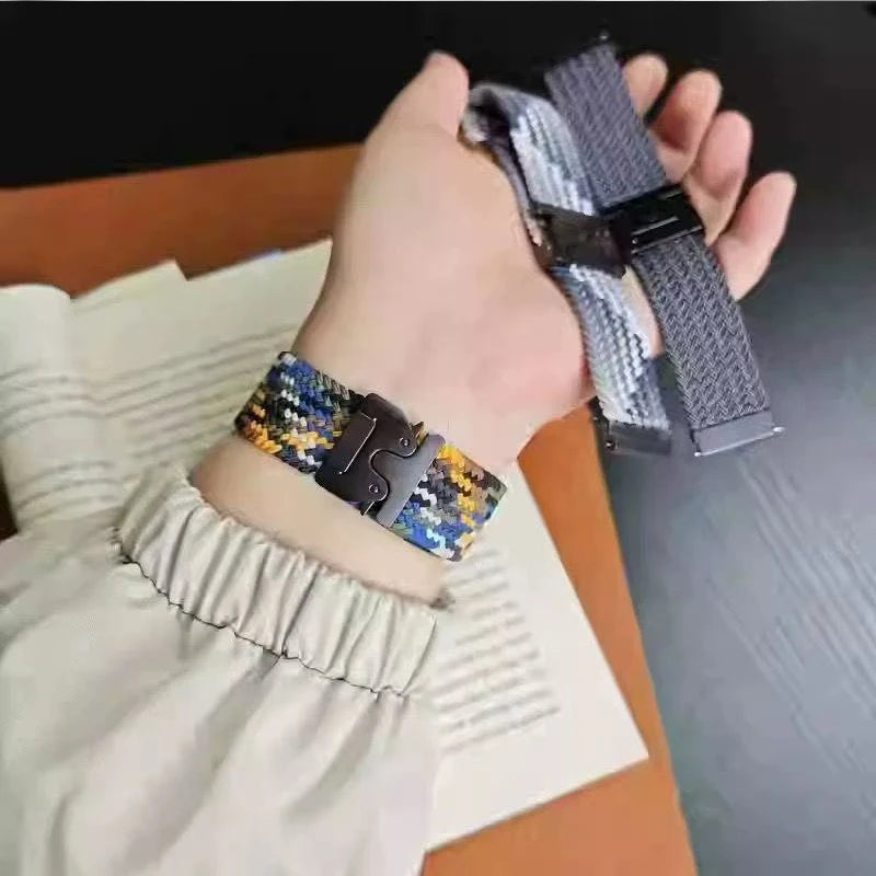 Garmin smartwatch braided nylon strap in colorful design, showing adjustable fit on wrist, alongside replacement bands.