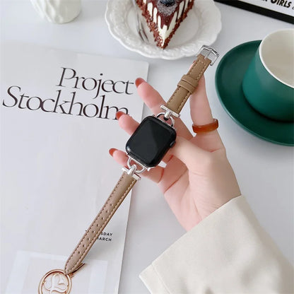 Apple Watch with genuine leather strap in hand, showcasing a classic and durable design for stylish versatility.
