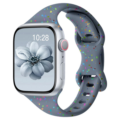 Apple Watch with colorful silicone band featuring a speckled design, showcasing style and comfort for all-day wear.
