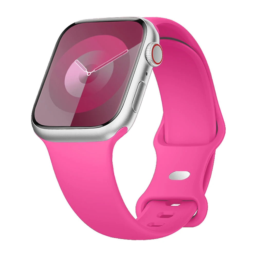 Apple Watch with pink silicone strap, soft, flexible, and waterproof for comfort during workouts.