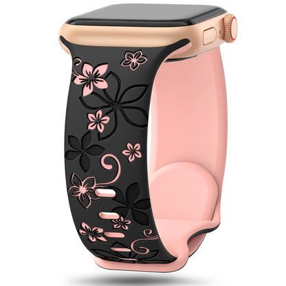 Apple Watch silicone strap with floral designs in black and pink, combining style and comfort for daily wear.