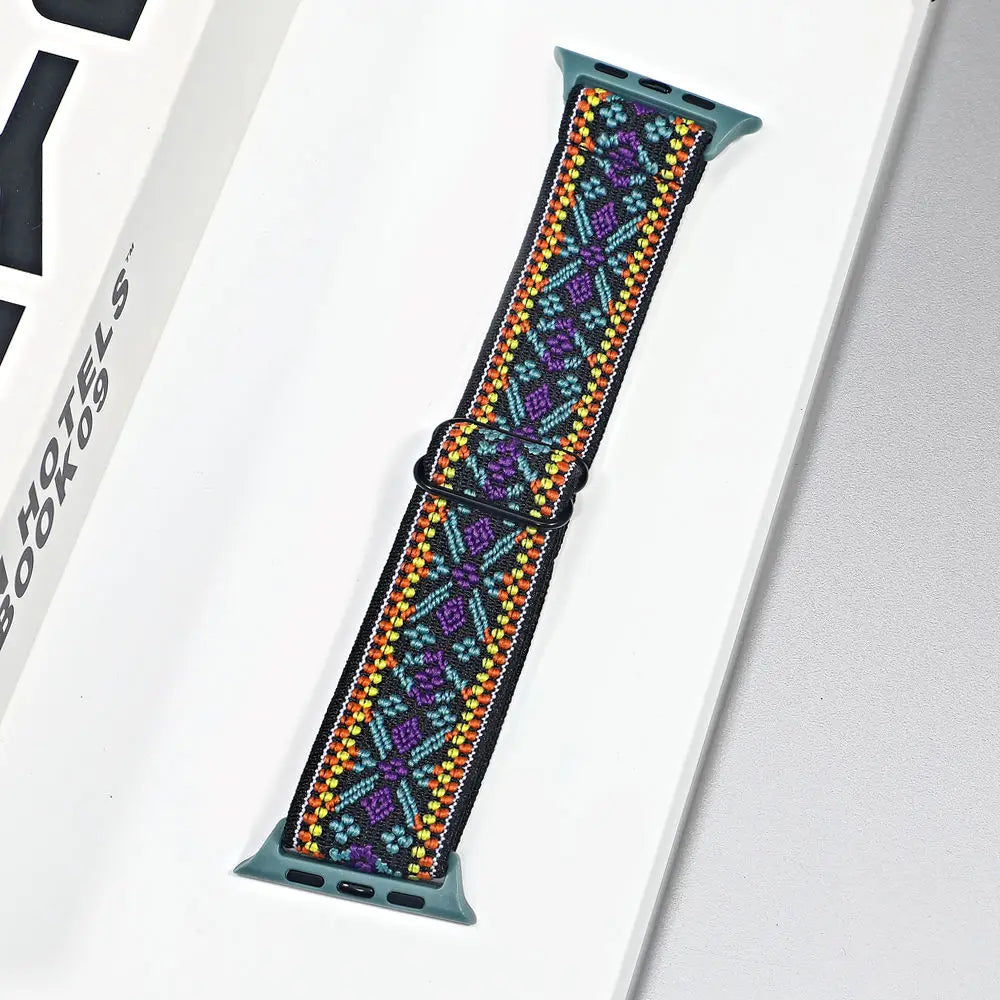 Colorful nylon sport loop strap for Apple Watch, showcasing intricate patterns and designed for comfort and breathability.