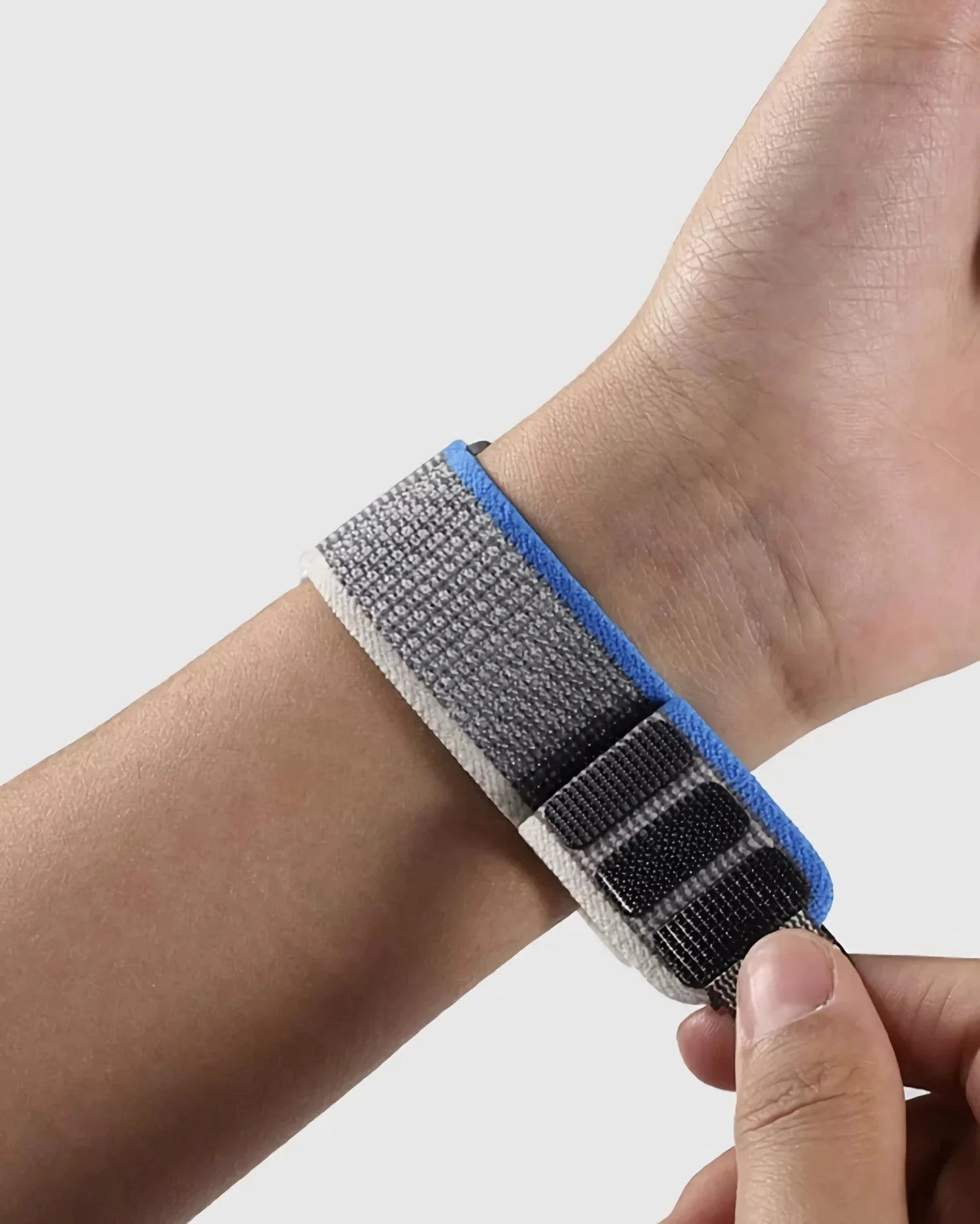 Garmin rugged woven nylon sport band on wrist, showcasing durability and comfort for an active lifestyle.