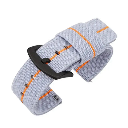 Lightweight nylon Suunto watch band in light gray with orange stripes, designed for ultimate comfort and ease of wear.
