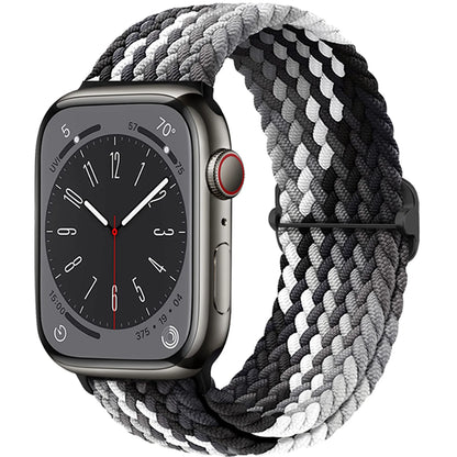 Apple Watch with braided soft elastic nylon strap in black and gray, offering comfort and style for daily wear.