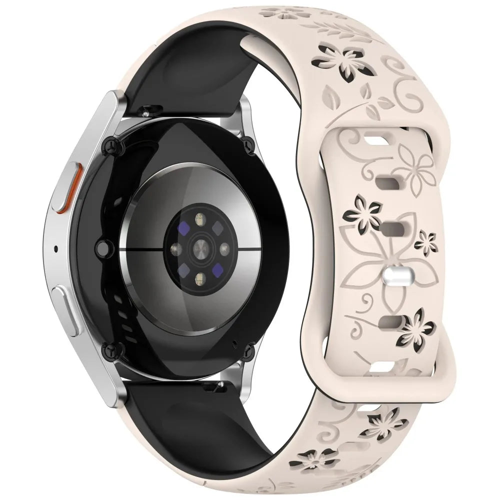Garmin Floral Engraved Silicone Band in black and starlight on a watch