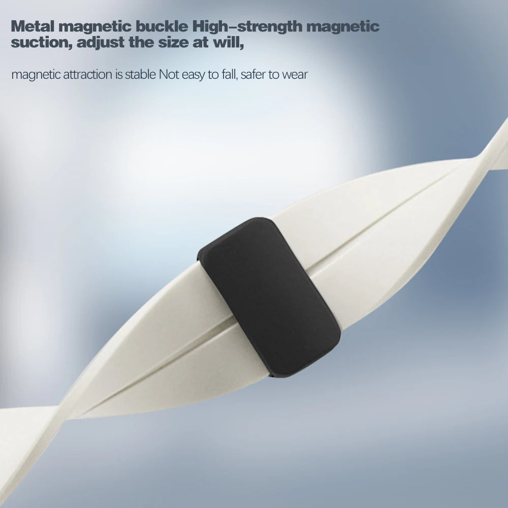 Close-up of a metal magnetic buckle on a silicone strap, showcasing its strong magnetic suction and adjustable fit.