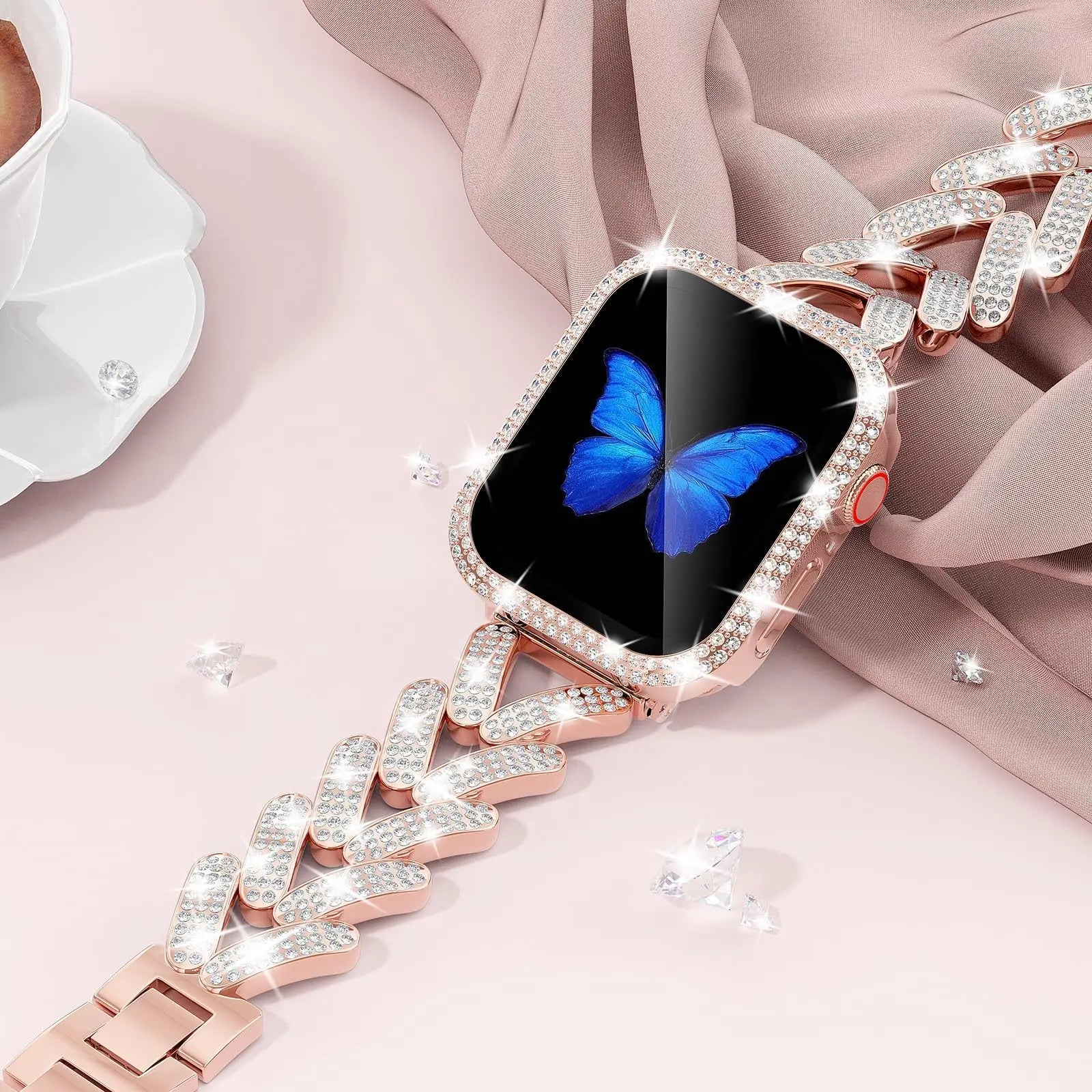 Apple Watch Stainless Steel Band with Sparkly Crystal Design and butterfly display on soft fabric background.