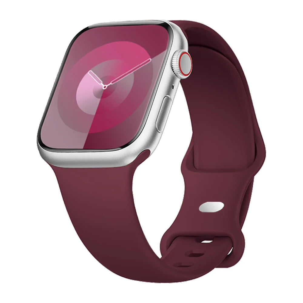 Apple Watch with a burgundy silicone strap, showcasing waterproof and flexible design for comfort and style.