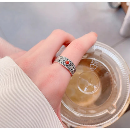 Carnelian band ring worn on a finger