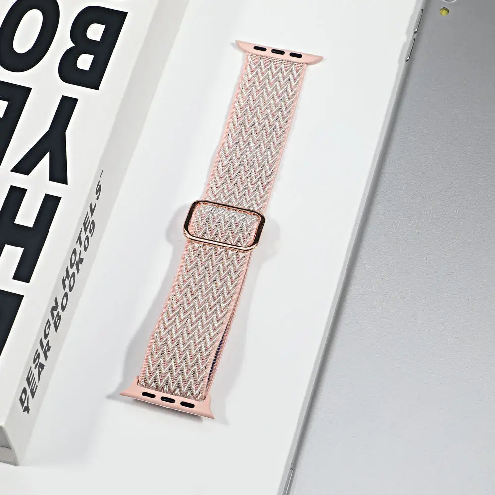Apple Watch nylon sport loop strap in soft pink, showcasing breathable fabric and stylish design for everyday use.