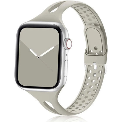 Apple Watch with a soft, flexible silicone strap featuring a breathable design and stylish gray color.