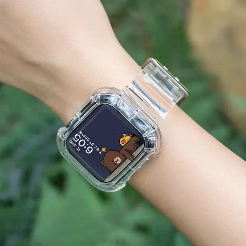 Clear transparent Apple Watch band styled on a wrist, showcasing a vibrant watch face with cartoon characters.