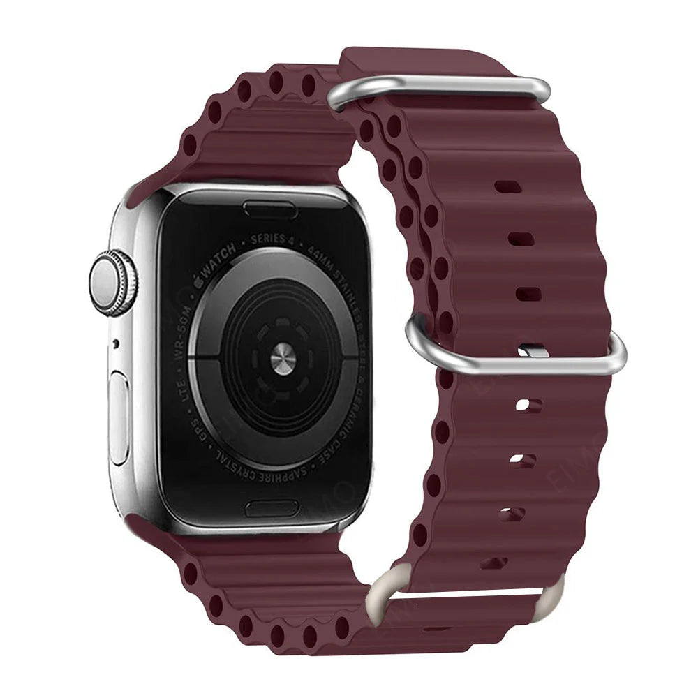 Apple Watch with burgundy silicone strap, designed for comfort, waterproof and breathable for active lifestyles.