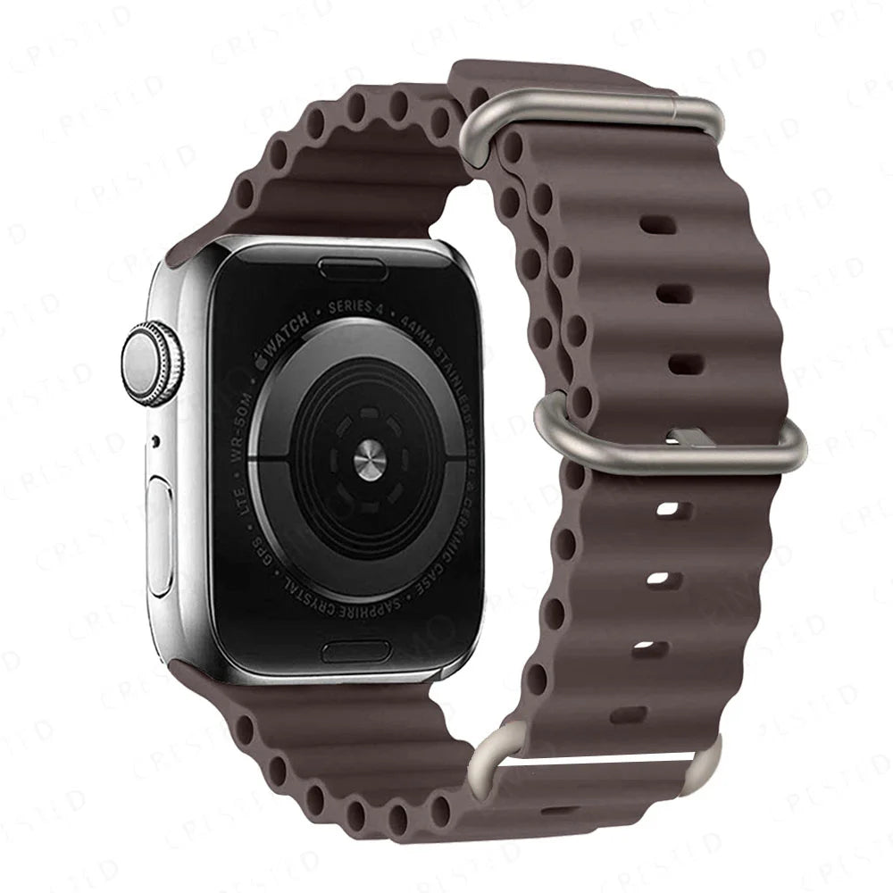 Apple Watch with brown silicone strap, waterproof and breathable for comfort during workouts and water sports.