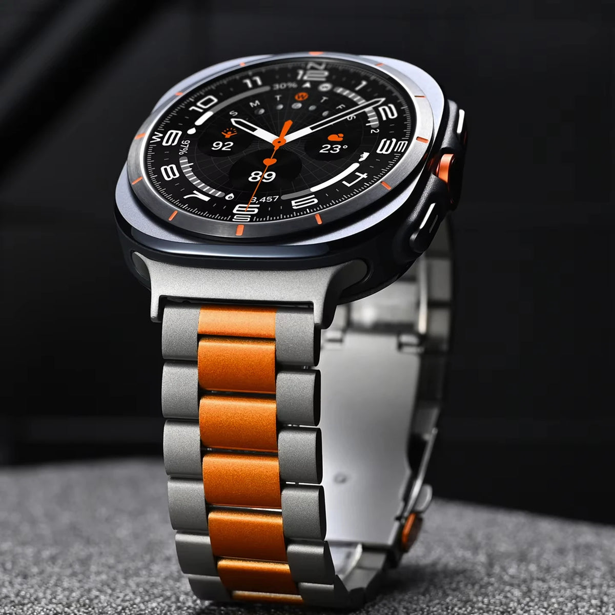 Samsung Galaxy Stainless Steel Link Watch Band - Ultra/Ultra2 on a watch with black dial and orange accents