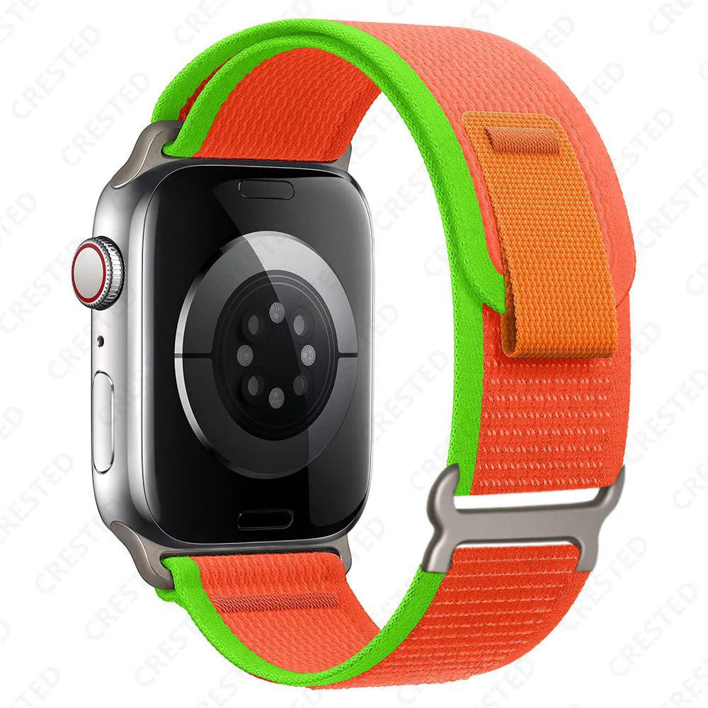 Apple Watch with Trail Loop Nylon Strap in vibrant orange and green, perfect for comfort and durability.