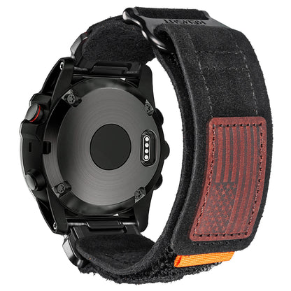 Garmin smartwatch with a black fabric strap featuring an American flag design, highlighting premium style and comfort.