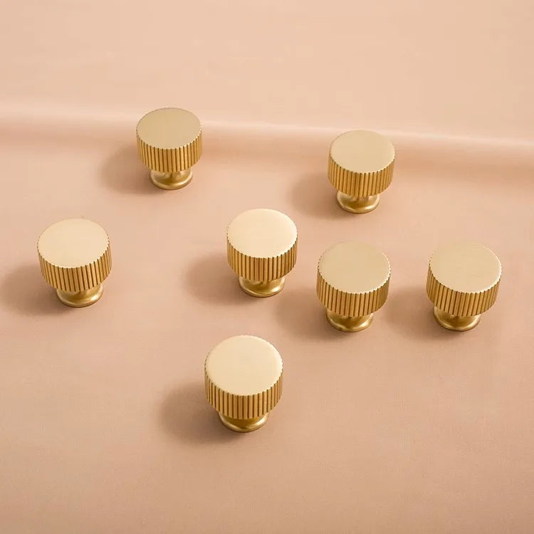 Fluted solid brass round cabinet knob in brushed brass