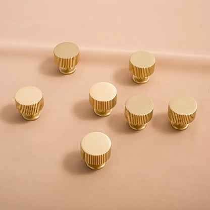 Fluted solid brass round cabinet knob in brushed brass