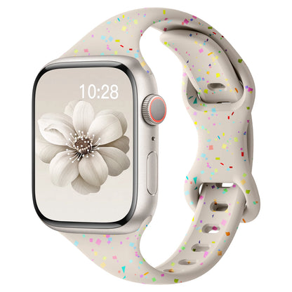 Apple Watch featuring a soft silicone band in colorful speckled design for comfort and style.
