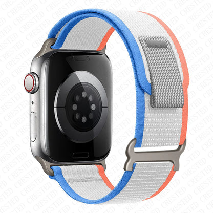 Apple Watch Trail Loop Nylon strap in blue and white, designed for durability and comfort for active lifestyles.