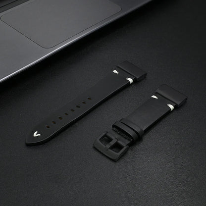 Black Garmin replacement strap displayed next to a laptop, perfect for style and comfort.