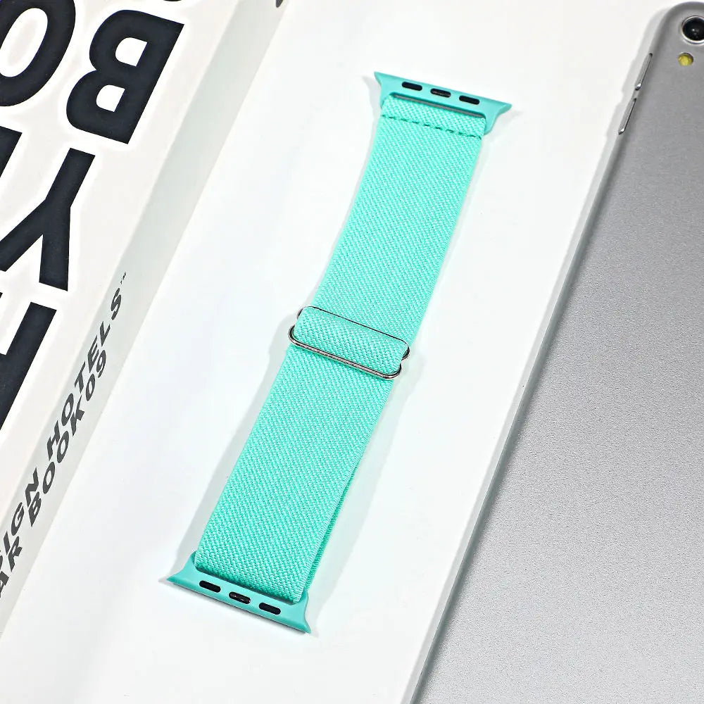 Light blue nylon sport loop strap for Apple Watch on a white background, showcasing its breathable fabric design.