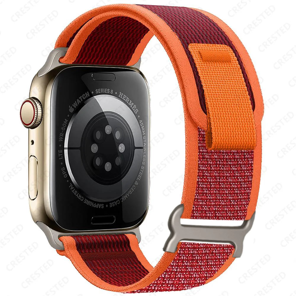 Apple Watch with Trail Loop nylon strap in red and orange, designed for style, comfort, and durability.