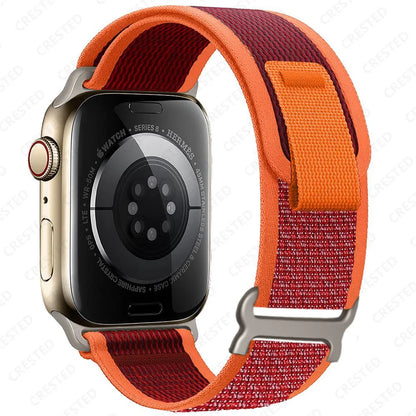 Apple Watch with Trail Loop nylon strap in red and orange, designed for style, comfort, and durability.