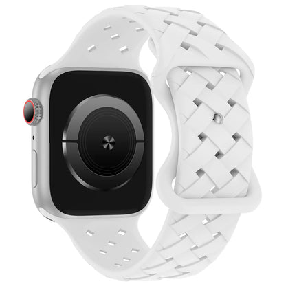 Apple Watch with sporty white braided silicone strap, offering breathability and comfort for active lifestyles.