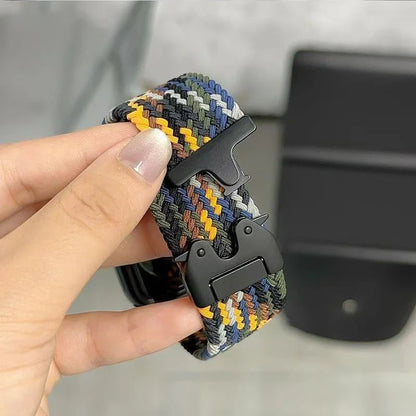 Colorful Garmin braided nylon strap, lightweight and durable replacement band for smartwatches, held in hand.