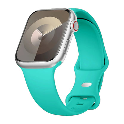 Apple Watch with a turquoise silicone strap, soft, flexible, and waterproof for all-day comfort and active wear.
