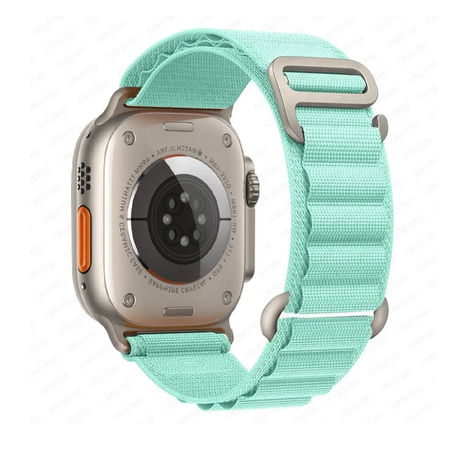 Apple Watch with rugged nylon strap in mint color, showcasing durable design and adjustable fit for outdoor activities.