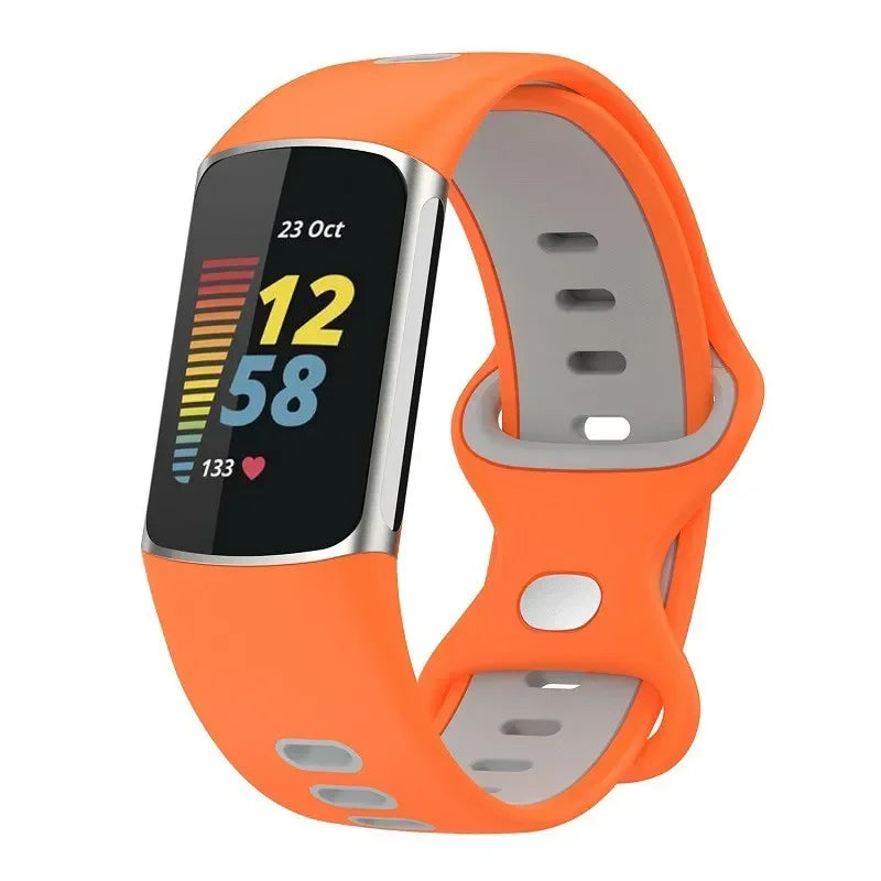 Fitbit Charge 5 with orange silicone strap, perfect for fitness tracking and stylish wear. Ideal smartwatch replacement band.