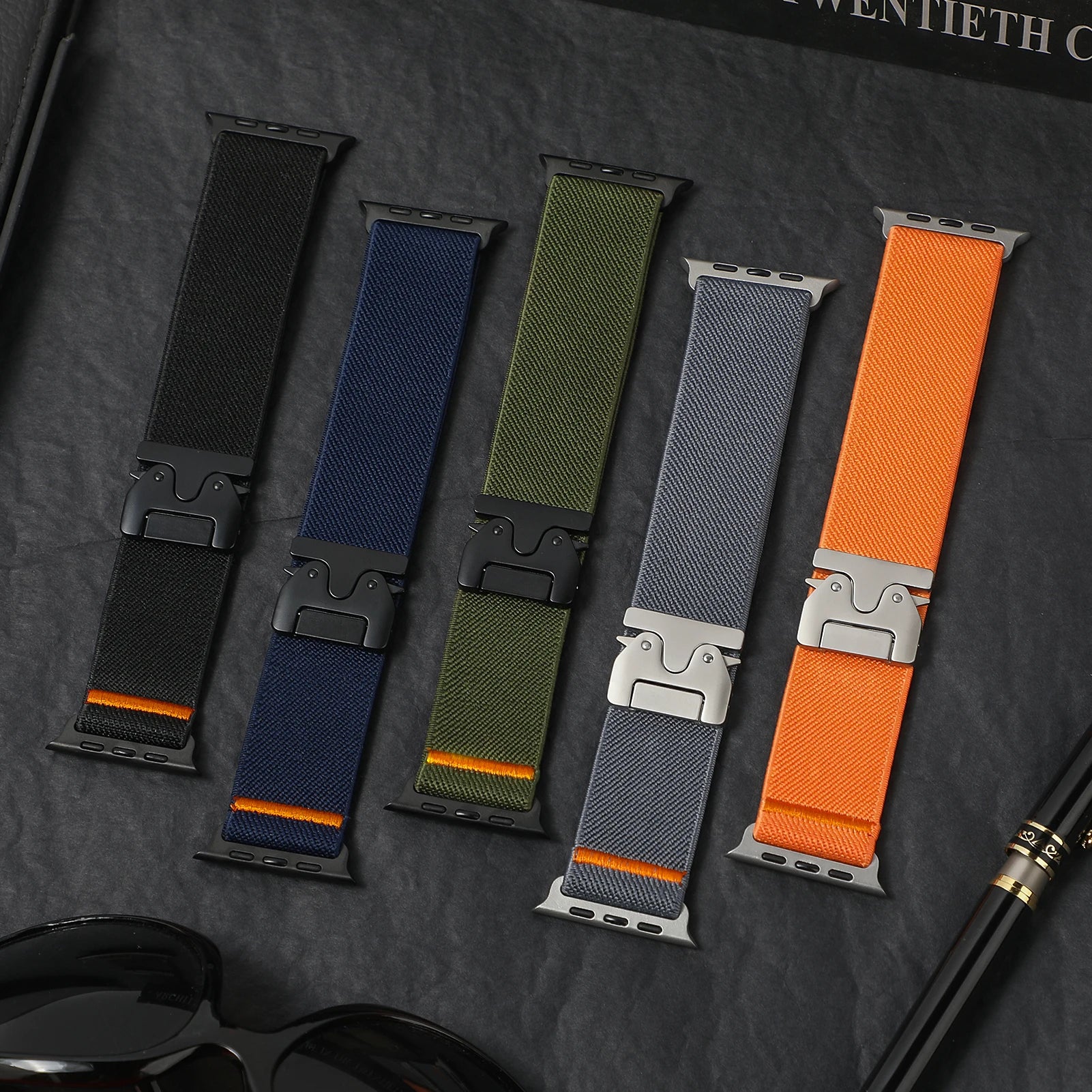 Five colorful nylon straps for Apple Watch, showcasing flexible, durable designs with secure buckles.