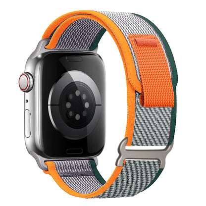 Apple Watch Trail Loop Nylon Strap in orange and gray, featuring a durable and adjustable design for comfort and style.