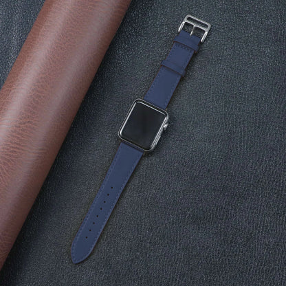 Apple Watch with a stylish blue fabric band on textured leather background, showcasing durability and comfort.