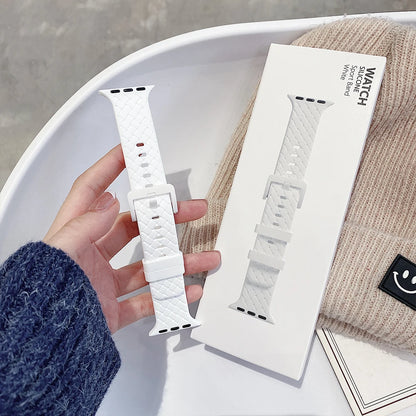 Apple Watch silicone strap in white, showcasing soft flexible design and comfortable fit for everyday wear.