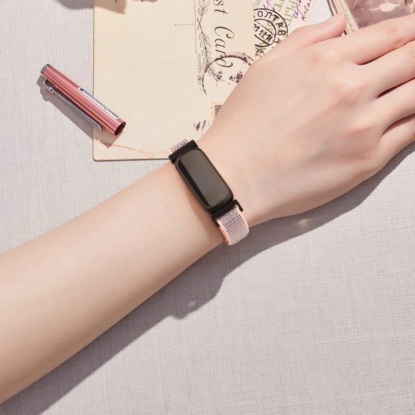 Fitbit Inspire 3 with adjustable nylon strap on wrist, showcasing comfort and style for everyday use.