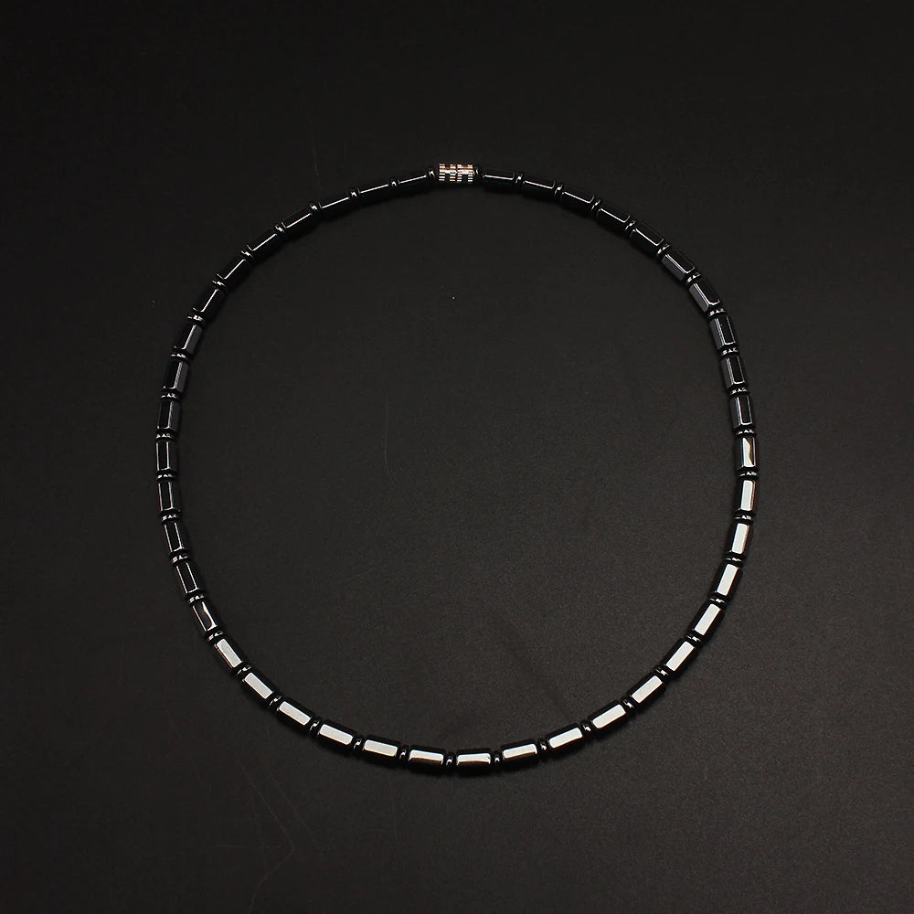 Simulated hematite bamboo bead necklace laid in a circle
