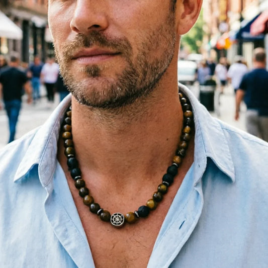 Man wearing tiger's eye bead necklace