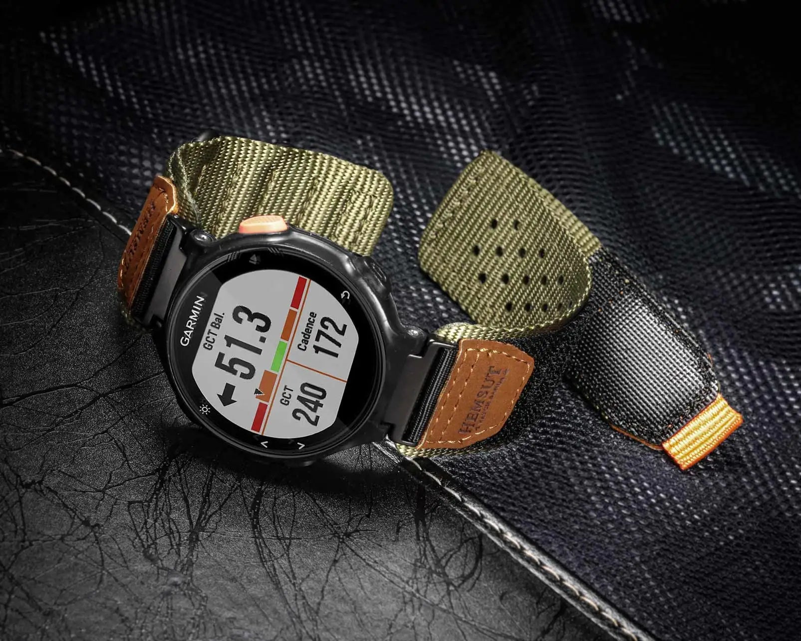 Garmin smartwatch featuring a rugged nylon band strap designed for active lifestyles and durable performance.