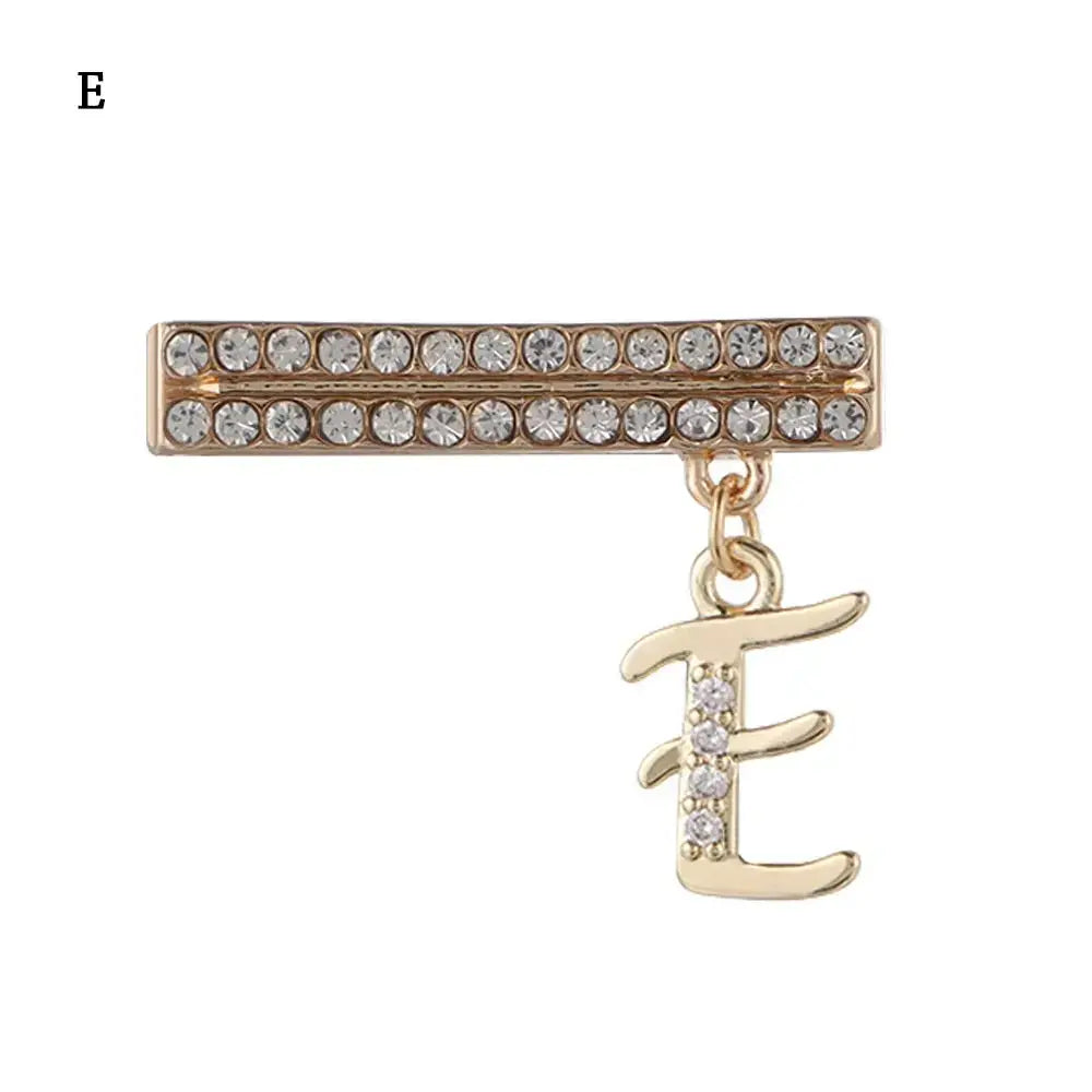 Decorative gold letter charm 'E' with sparkling crystals for Apple Watch band, enhancing style and luxury.