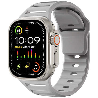 Apple Watch with gray silicone strap, featuring a colorful health monitor display and waterproof design for active lifestyles.