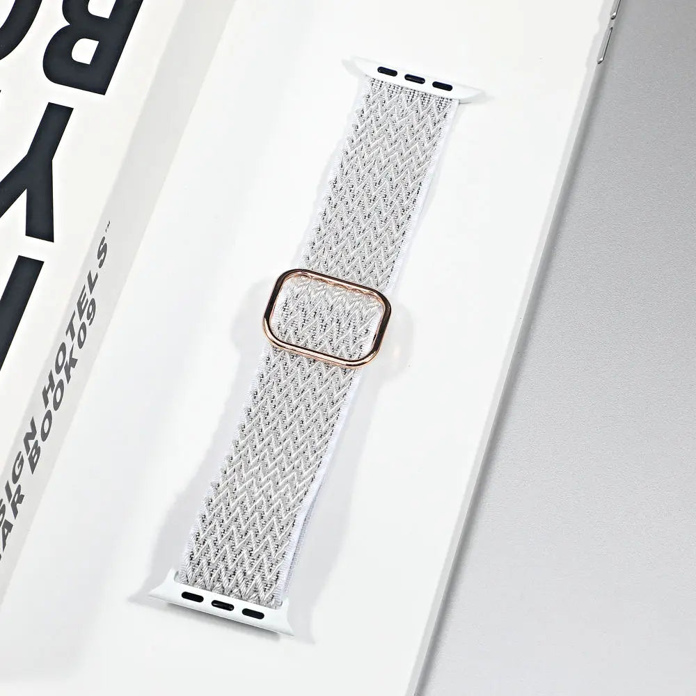 Apple Watch nylon sport loop strap in white, featuring a breathable design and gold buckle, perfect for style and comfort.
