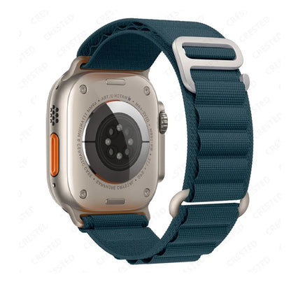Apple Watch with rugged nylon alpine loop strap in teal, showcasing durability and comfort for outdoor activities.