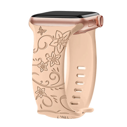 Apple Watch silicone strap with floral engraving, soft and waterproof, ideal for all-day wear.
