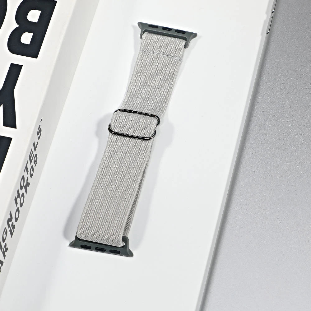 Apple Watch nylon sport loop strap in gray color, showcasing breathable fabric for comfort and style.